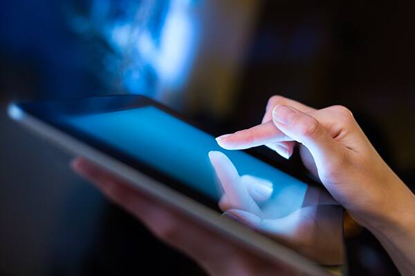 woman using tablet
