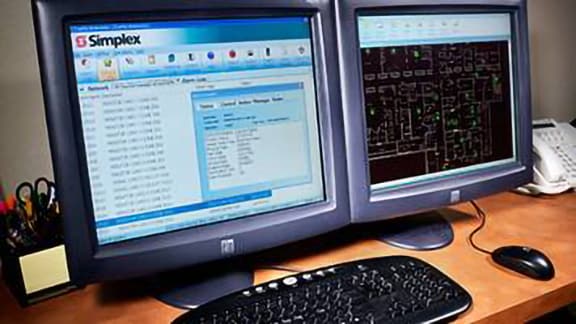 TrueSite interface displayed on two computer monitors