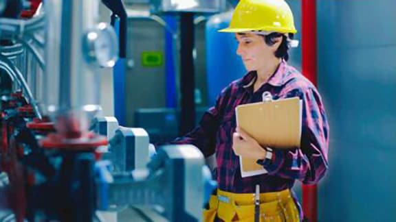 An engineer checking an hvac equipment