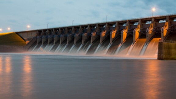 opened-dam-gates-with-water-flowing-out