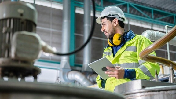 Technician looking into tablet
